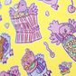 Colorful pattern of cartoon characters and food items on a yellow background