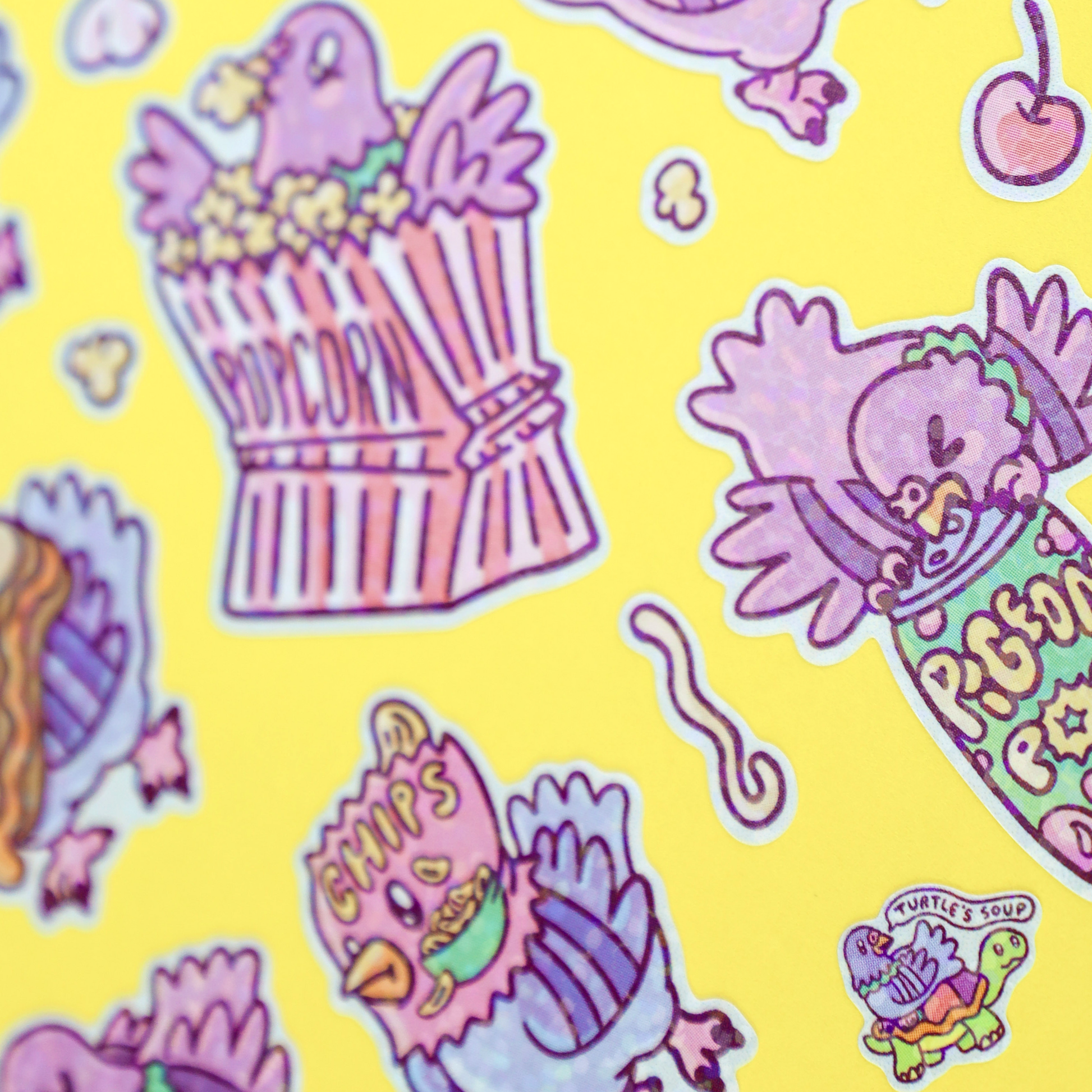Colorful pattern of cartoon characters and food items on a yellow background