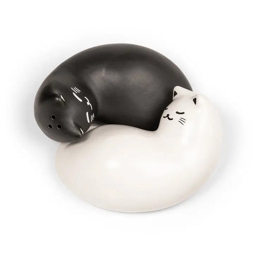 Black and white cat-shaped salt and pepper shakers on a white background
