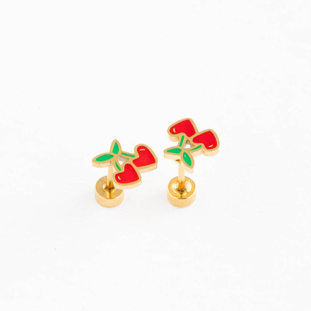 Gold earrings with red cherries on a white background