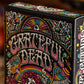 Grateful Dead playing cards box with colorful design on a blurred background