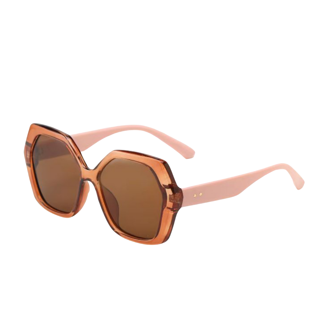 Sunglasses with a brown lens and pink frame on a white background