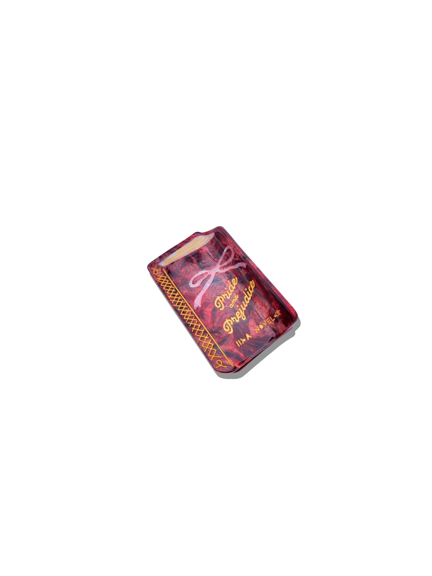 small book hair claw that says "Pride and Prejudice" on a white background