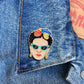 Frida Kahlo pin on a denim jacket