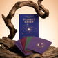 Book titled 'Planet Grief' with cards on a wooden surface