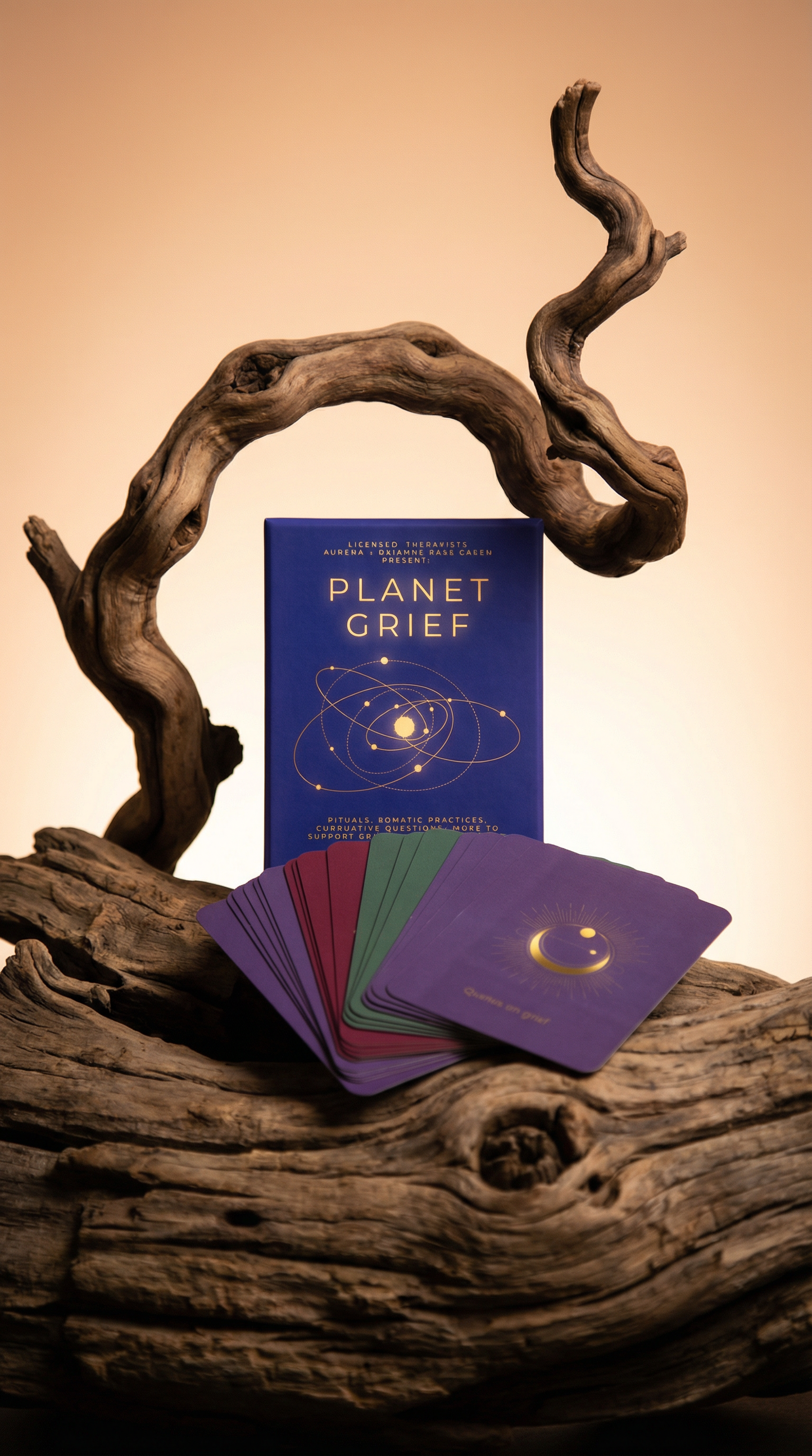 Book titled 'Planet Grief' with cards on a wooden surface