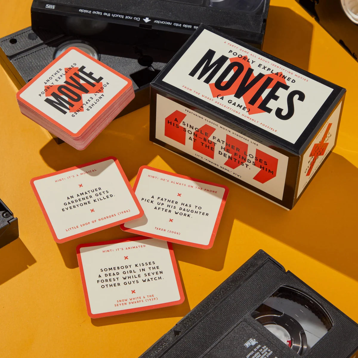 Poorly explained movies card game among cassette tapes