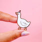 Pin of a goose with a pink background