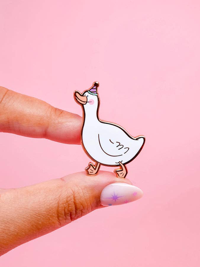 Pin of a goose with a pink background