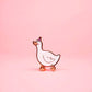 Cartoon goose pin on a pink background