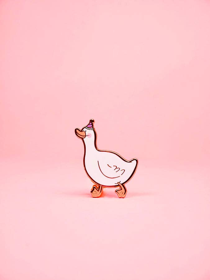 Cartoon goose pin on a pink background