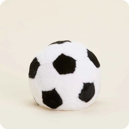 Plush soccer ball toy on a beige background
