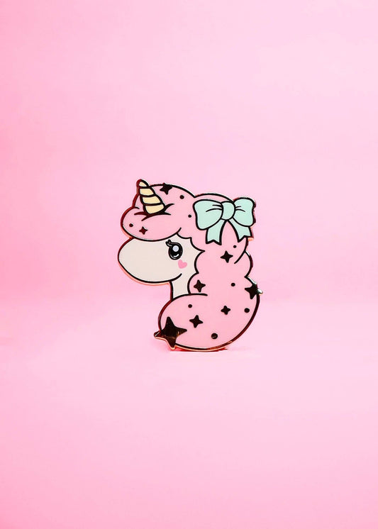 Cartoon unicorn with a bow on a pink gradient background